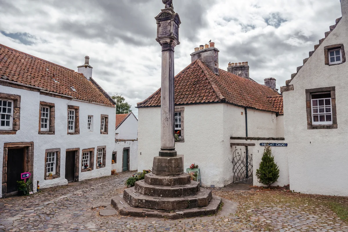 The Mercat Cross and painted houses of Culross — the village of Cranesmuir in Outlander